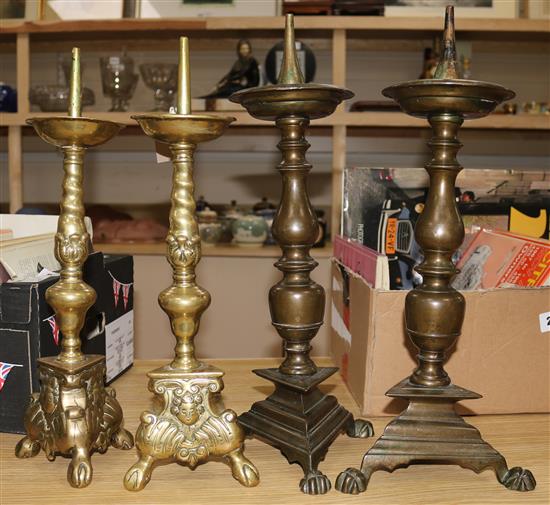 Two pairs of 17th century style bronze / brass candlesticks, height 16.5in. and 15in.